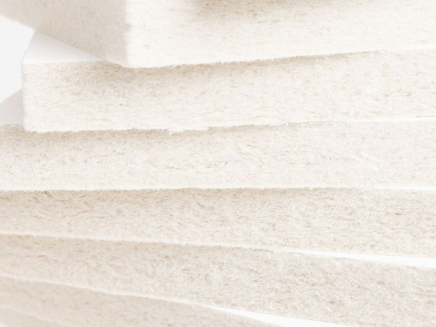 A pile of Aisti acoustic tiles