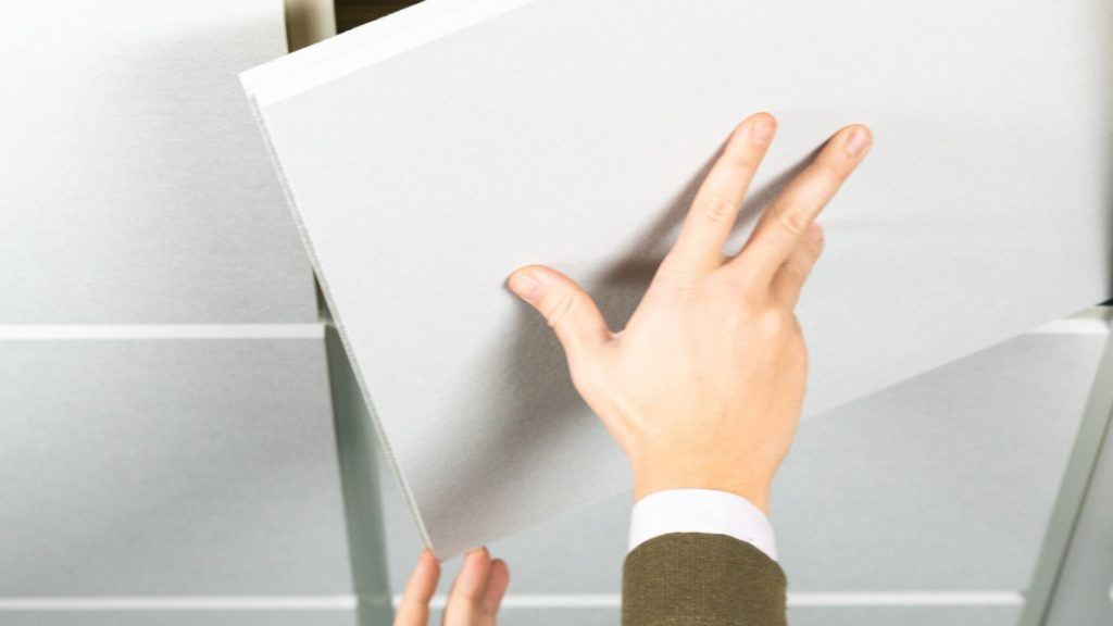 Hands Touching Acoustic Ceiling Tiles
